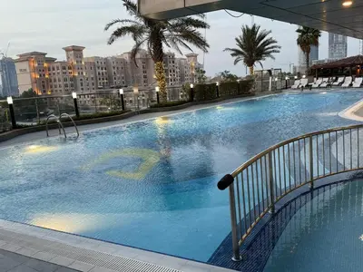 a large swimming pool on top of a building at Luxury 2 BHK in Ocean Heights at Dubai Marina Living with Stunning Views in Dubai