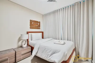 a white bedroom with a bed and a window at Majestic 3BR Villa in DH2 by Deleguest in Dubai