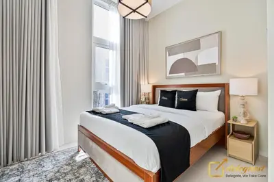 a bedroom with a large bed and a large window at Majestic 3BR Villa in DH2 by Deleguest in Dubai