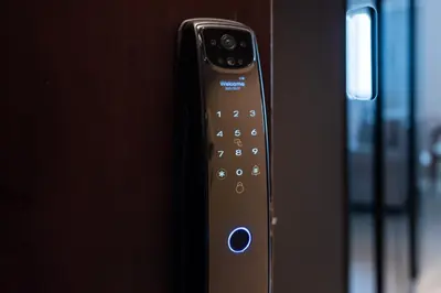 a close up of a remote control in a room at Luxury JLT Studio Renovated Lake View Metro in Dubai