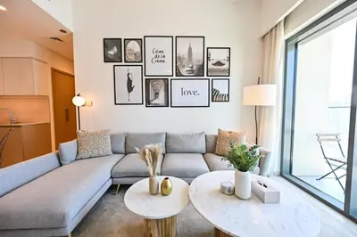 a living room with a couch and a table at BEST Burj Khalifa View 2br 3 beds in Dubai