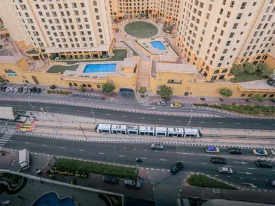 an overhead view of a city street with a bus at Superb 2BR Prime Locale between Dubai Marina JBR in Dubai