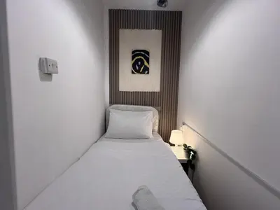a small room with a small bed in it at Deluxe solo Room In Barsha Heights Tecom in Dubai