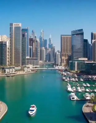 a view of a city with boats in a harbor at The S Royal Marina Boutique Stay For Ladies And Families Only in Dubai