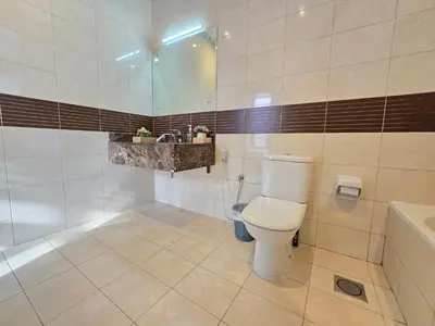 a bathroom with a toilet and a sink at Efficiancy studio 6mins walk to metro Near DWTC in Dubai