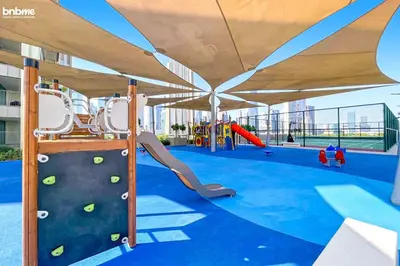 an indoor playground with a slide and a play structure at bnbmehomes - Downtown Views II in Dubai