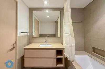 a bathroom with a sink and a mirror and a tub at Next to Burj Khalifa & Dubai Mall - Luxury 2BR with Dubai Skyline Views - Like Home in Dubai