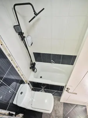 a bathroom with a white toilet and a shower at Best location in Marina & jbr and marina view 1 minute from JBR in Dubai