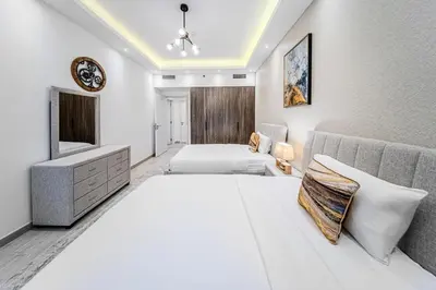 a hotel room with two beds and a television at Chic 2BD in Lamtara for 4, Madinat Jumeirah Living in Dubai