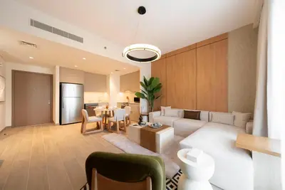 a living room with a couch and a table at Ultra Luxuary 2BR - Creek Beach - Serenity Living in Dubai