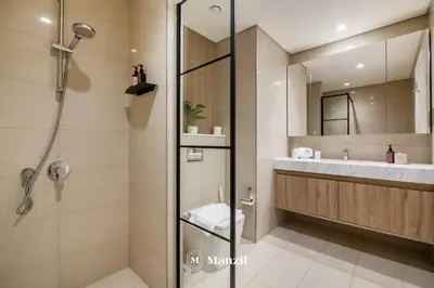 a bathroom with a shower and a sink at Luxury 2BR Apartment in Downtown with Full Burj Khalifa View in Dubai