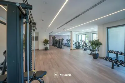 a gym with a lot of treadmills and machines at Luxury 2BR Apartment in Downtown with Full Burj Khalifa View in Dubai