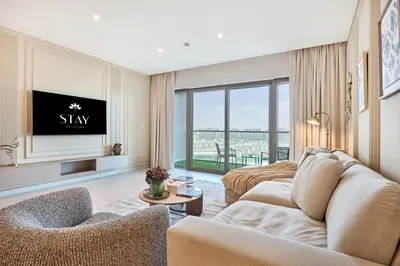 a living room with a couch and a tv at STAY BY LATINEM Luxury 2BR Holiday Home CVG 907 Near Burj Khalifa in Dubai