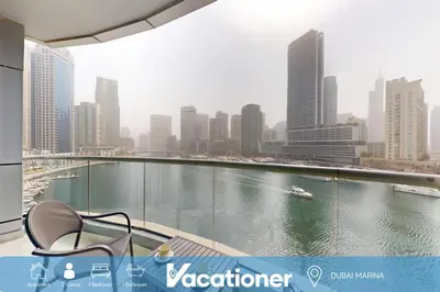 a balcony with a view of a river in a city at The Point - One Bed with Marina Skyline Views in Dubai