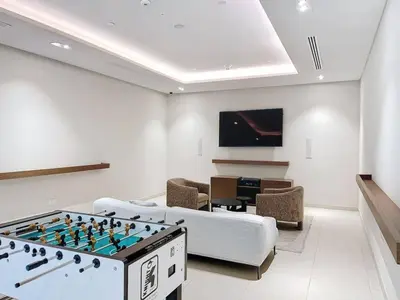 a living room with a foosball table in the middle at 5242 Tower 2 - One Bed, Low Floor with Canal View in Dubai