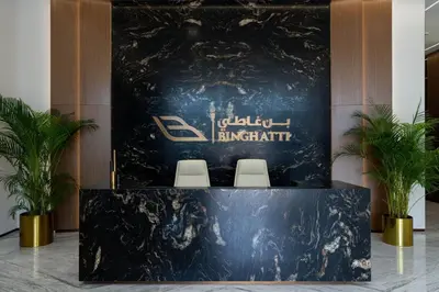 a lectern in a lobby with two chairs and a sign at Fully Equipped Studio with Kitchen and Free Wi-Fi in Dubai