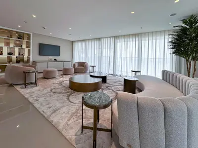 a living room with a couch and a tv at Fantastic 2BR apartment Palm, Sea and Sunset Views in Dubai