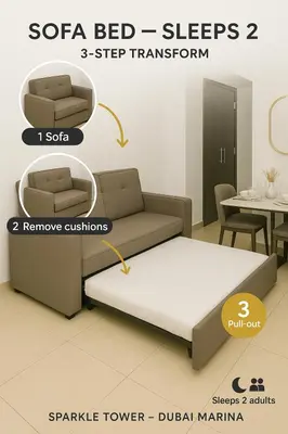 a room with a bed and a couch and a table at Sparkle Tower by Swarovski, Full Marina View, 2min JBR & Metro, Sleeps 4 in Dubai