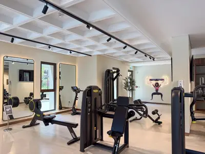 a gym with treadmills and elliptical machines at The Smart Concierge - Jadeel 1 MJL in Dubai
