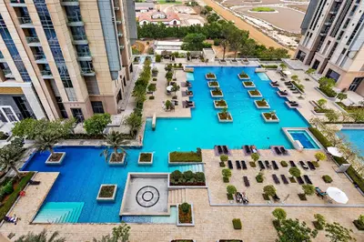 an overhead view of a pool in a building at Stylish 1BR Apartment at Meera Tower in Dubai