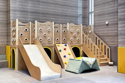 a childrens playground with a slide and a play equipment at Stylish 1BR Apartment at Meera Tower in Dubai