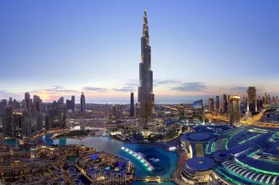 a view of a city with a tall skyscraper at Versatile 1BR with Burj Khalifa View in Dubai