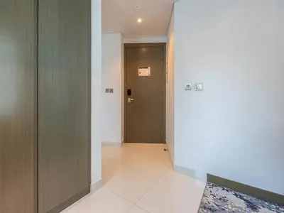 a hallway with a door at Luxury Studio | Near Dubai Mall | Lake View in Dubai