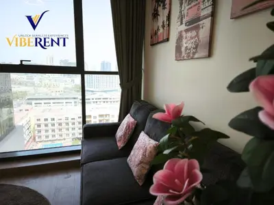 a living room with a couch and a window at 1BHK Pool Sauna 15 Min to Marina in Dubai