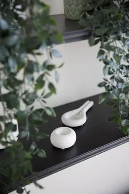 a black tray with a white spoon and a mirror at Modern 1-BR Apartment with Cozy Vibes Pool Gym in Dubai