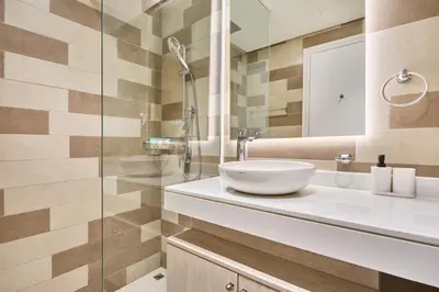 a bathroom with a sink and a shower at Beachfront Bliss Seven Palm in Dubai