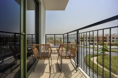 a balcony with chairs and a view of a street at Premium Apartment mit Strandzugang in Dubai in Dubai
