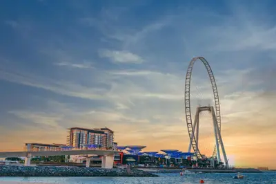 a large ferris wheel in front of a resort at Luxury Modern Apt in JBR 2 MIN to BEACH in Dubai