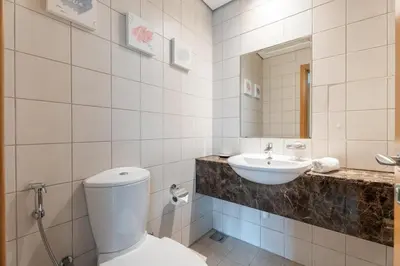 a bathroom with a toilet and a sink at GuestReady - Canal View Stay in Business Bay in Dubai