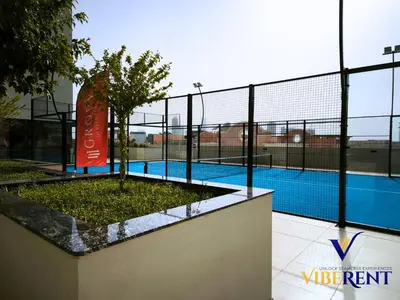 a fence around a swimming pool with a sign on it at Explore Dubai from Aura - 2BHK in Dubai