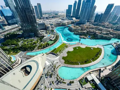an aerial view of a city with tall buildings at GRANDE RESIDENCES with a direct Burj Khalifa view and Private Fountain Show at 62nd floor with DXB AIRPORT VIP Shuttle option for 8 guests in Dubai