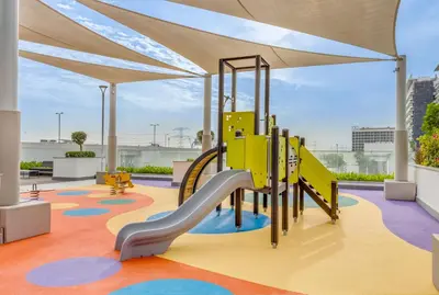 a playground in a building with a slide at 1BR Royal Bedroom with Pool & Gym Free in Dubai