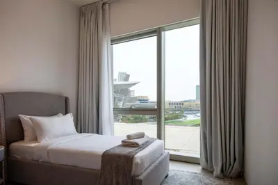 a bedroom with a bed and a large window at TRPS - Grande, Downtown - Full Burj Khalifa View, Luxury Furnished - Close to Dubai Mall in Dubai