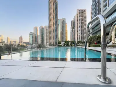 a swimming pool in the middle of a city with tall buildings at TRPS - Grande, Downtown - Full Burj Khalifa View, Luxury Furnished - Close to Dubai Mall in Dubai