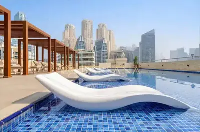 a pool with a white tub on top of a building at Barsana - Lavish 3BR Retreat - Marina & Sea Views in Dubai
