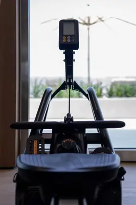 a camera on a tripod in front of a window at Newly Furnished Studio Haven in Binghatti Azure in Dubai