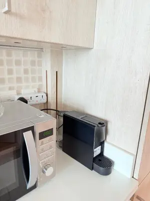 a kitchen with a microwave oven and a microwave at FullSeaView-RoofTopPool Free Private WestBeachAccess in Dubai