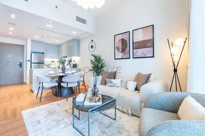a living room with a couch and a table at Canal and Burj Khalifa Views, Few Minutes Drive to Downtown Dubai and 15 Minutes Drive to Kite Beach, Binghatti Canal, Business Bay by Deluxe Holiday Homes in Dubai