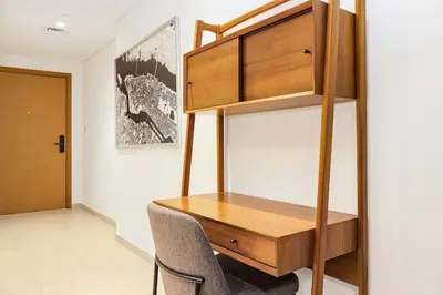 a bedroom with a desk and a bunk bed at FIRST CLASS 1BR Modern Comfort in the City in Dubai
