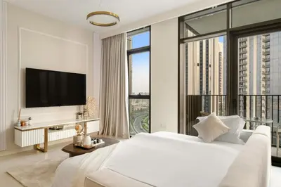 a bedroom with a large white bed and a large window at Prime 2BR Retreat, Creek Harbour Views & Comfort Near Restaurants in Dubai