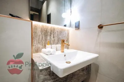 a bathroom with a white sink and a mirror at Beautiful Brand New Studio in Dubai
