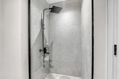 a bathroom with a shower with a glass door at New Studio in Meydan I MAG 890 in Dubai
