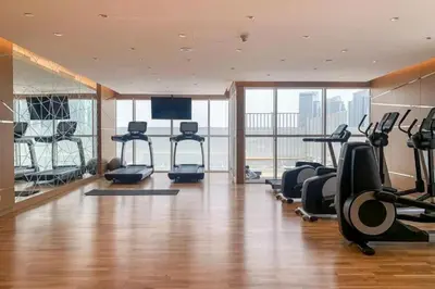 a gym with treadmills and exercise equipment in a building at Carson A - High Rise Cosy Studio with City Views in Dubai
