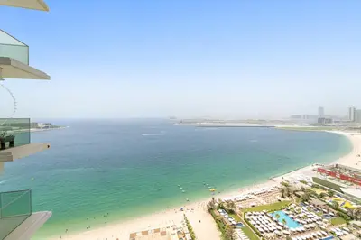 an aerial view of a beach and the ocean at Sea View 2BR Apartment With Private Beach in Dubai