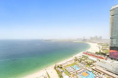 an aerial view of a beach and the ocean at Sea View 2BR Apartment With Private Beach in Dubai