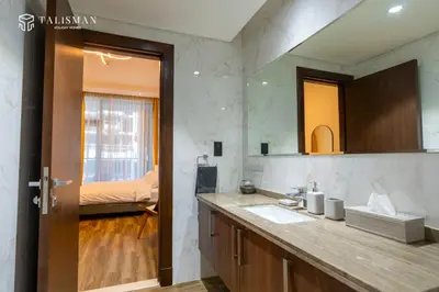 a bathroom with a sink and a mirror at Elegant 1 BR Apartment in J One Tower in Dubai